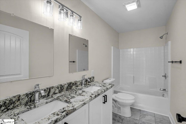 full bath with shower / washtub combination, toilet, marble finish floor, and a sink