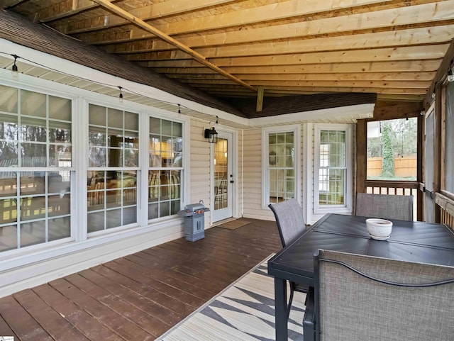 wooden terrace featuring outdoor dining space