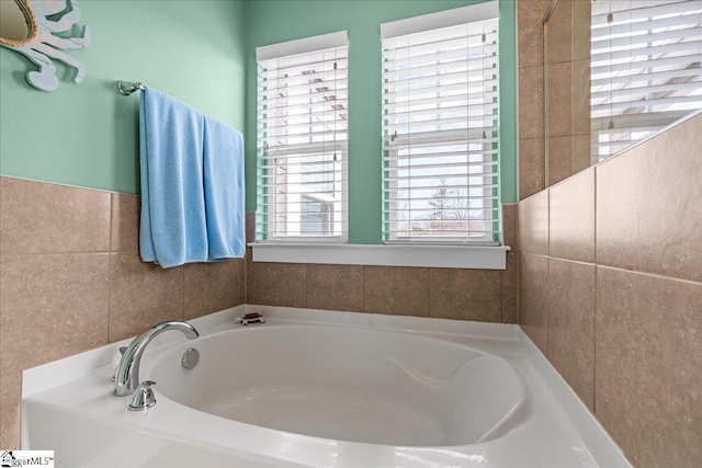 bathroom with a garden tub