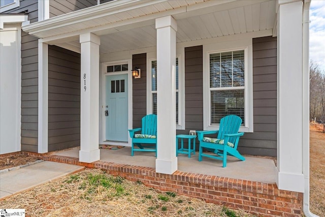 doorway to property featuring covered porch