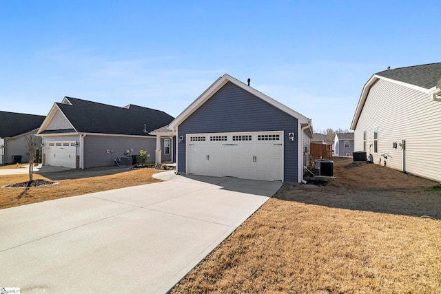 view of front of house featuring central AC unit and concrete driveway