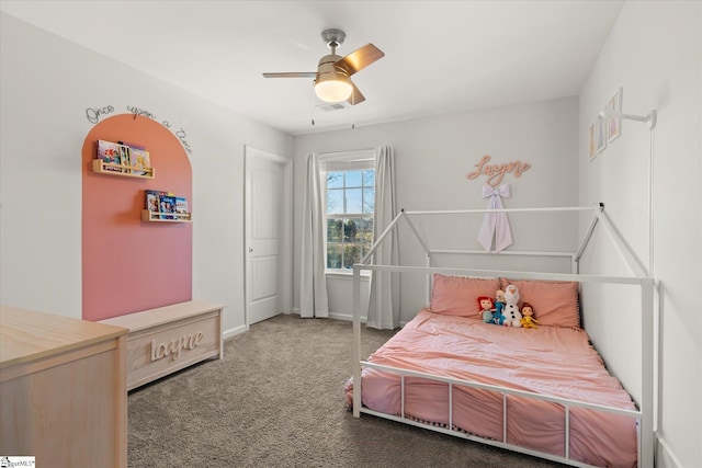 carpeted bedroom with baseboards and a ceiling fan