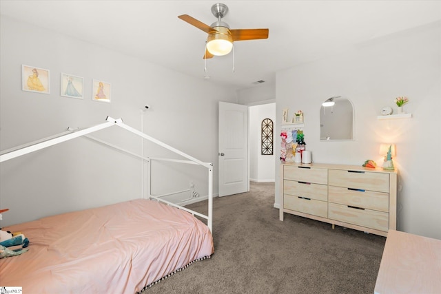 carpeted bedroom with visible vents and a ceiling fan