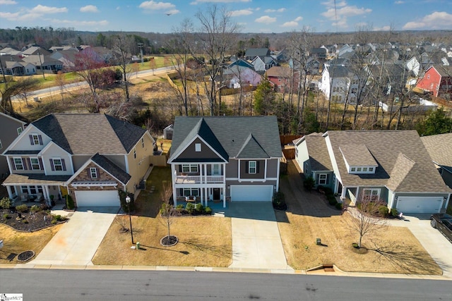 birds eye view of property with a residential view