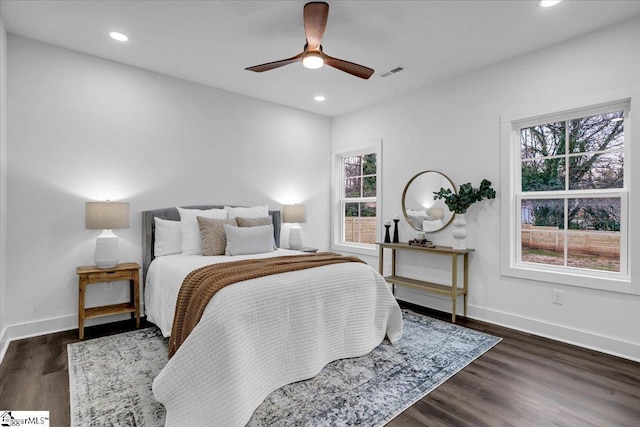 bedroom with visible vents, recessed lighting, baseboards, and wood finished floors