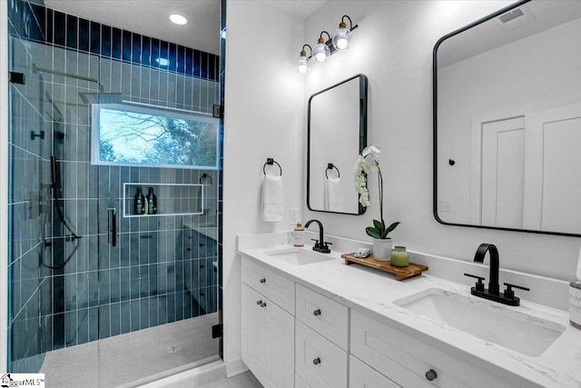 bathroom featuring a sink and a shower stall