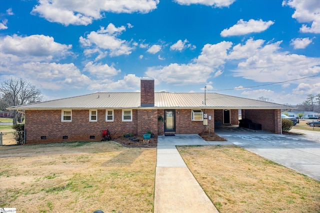 ranch-style home with driveway, a chimney, a front lawn, a carport, and brick siding