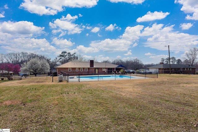 pool featuring a yard and fence