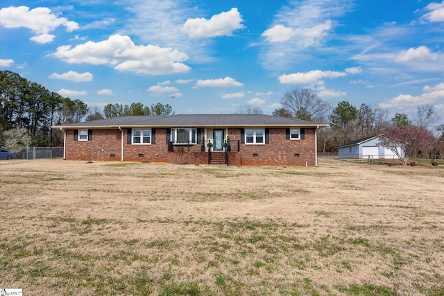 ranch-style house with crawl space, brick siding, a front lawn, and fence