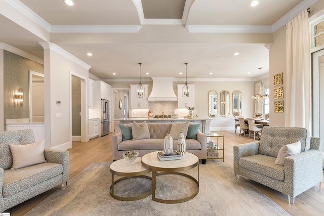 living room featuring light wood finished floors, recessed lighting, baseboards, and ornamental molding