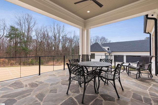 view of patio / terrace featuring outdoor dining area and a ceiling fan