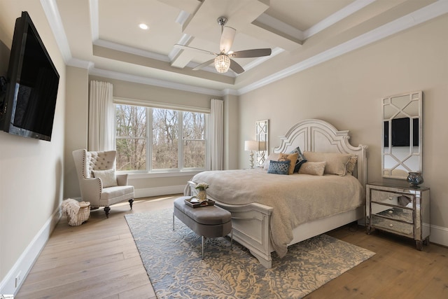 bedroom with coffered ceiling, crown molding, baseboards, and wood-type flooring