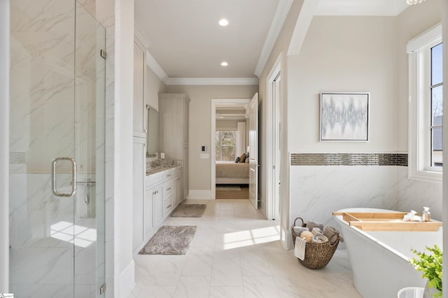 ensuite bathroom with a marble finish shower, a freestanding bath, crown molding, marble finish floor, and connected bathroom