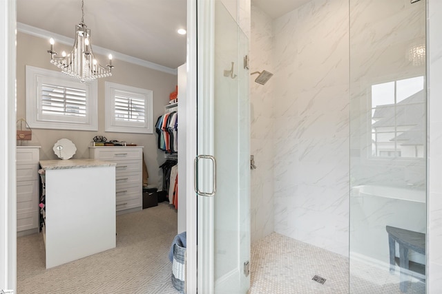 bathroom featuring a marble finish shower, a walk in closet, an inviting chandelier, and ornamental molding