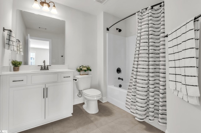 bathroom featuring tile patterned flooring, visible vents, toilet, shower / bath combo with shower curtain, and vanity