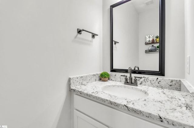 bathroom featuring vanity and visible vents