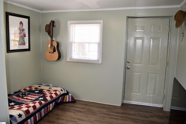 bedroom featuring dark wood finished floors and ornamental molding