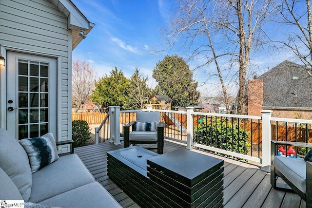 wooden deck featuring outdoor lounge area