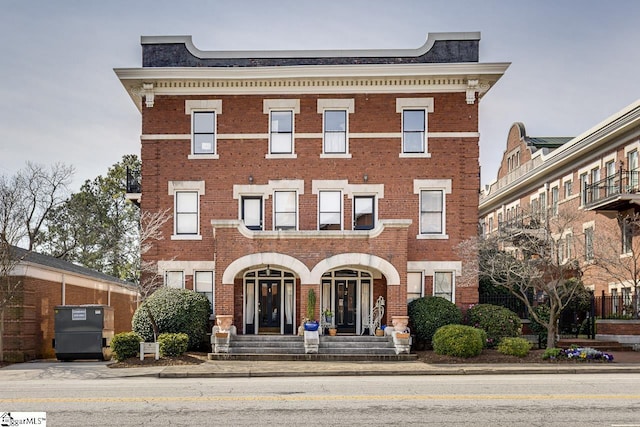 view of front of house featuring brick siding