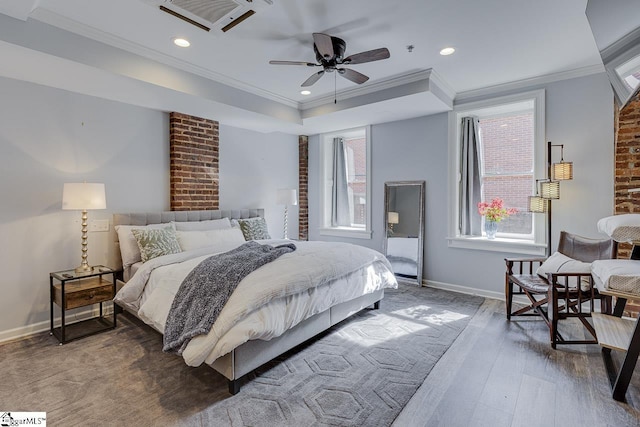 bedroom with wood finished floors, visible vents, baseboards, recessed lighting, and crown molding