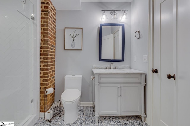 full bath with a shower stall, baseboards, toilet, tile patterned floors, and vanity