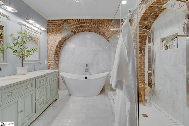 bathroom featuring a sink, tiled shower, a freestanding bath, and double vanity