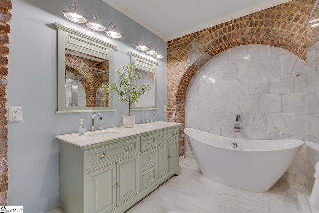 bathroom with double vanity, a soaking tub, crown molding, and a sink