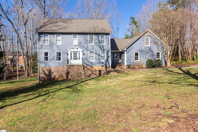 colonial-style house with a front yard