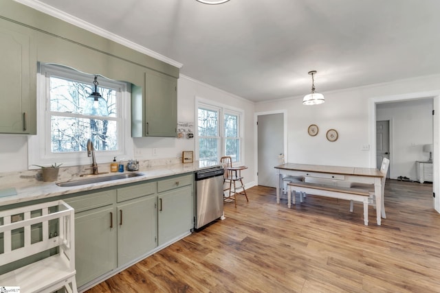 kitchen featuring light wood-type flooring, a sink, stainless steel dishwasher, crown molding, and light countertops