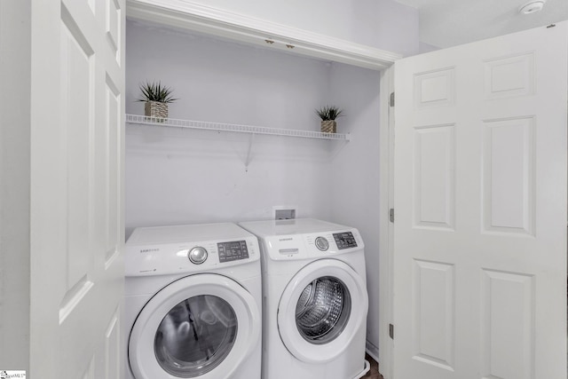 laundry area featuring independent washer and dryer and laundry area