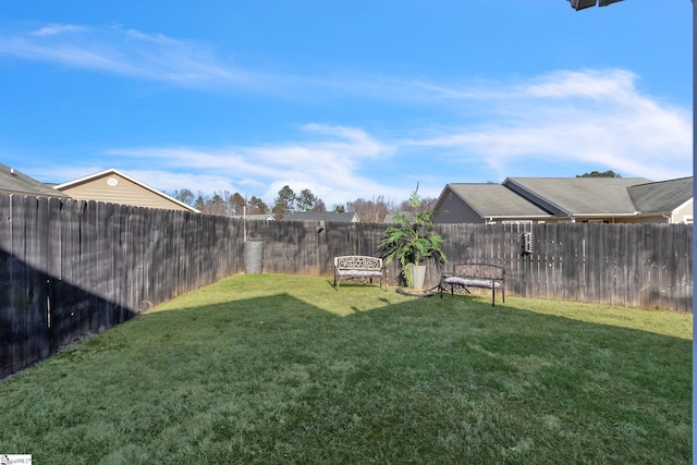 view of yard featuring a fenced backyard