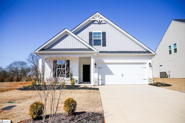 modern farmhouse with covered porch, board and batten siding, and driveway