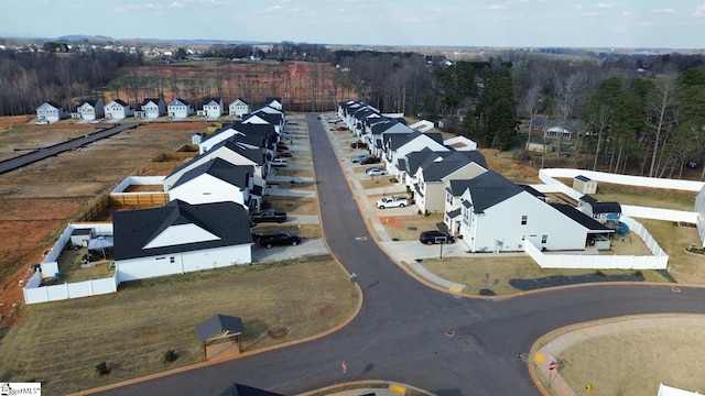 bird's eye view featuring a residential view and a view of trees