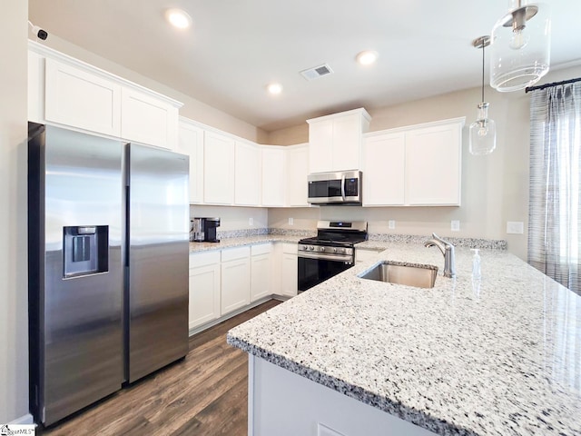 kitchen with visible vents, recessed lighting, white cabinets, stainless steel appliances, and a sink