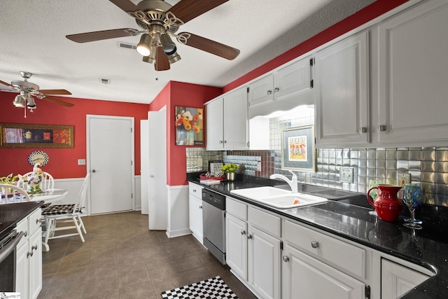 kitchen featuring a sink, dark countertops, dishwasher, and a ceiling fan