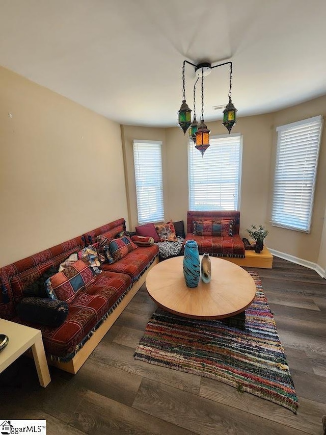 living room with wood finished floors and baseboards