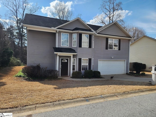 view of front facade with an attached garage and driveway