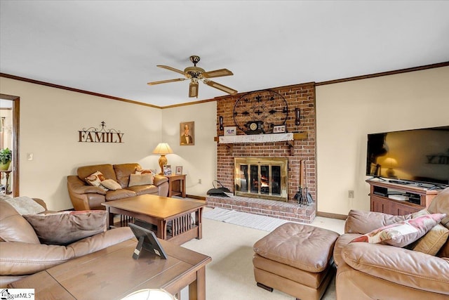 living room with carpet, baseboards, a fireplace, ceiling fan, and crown molding