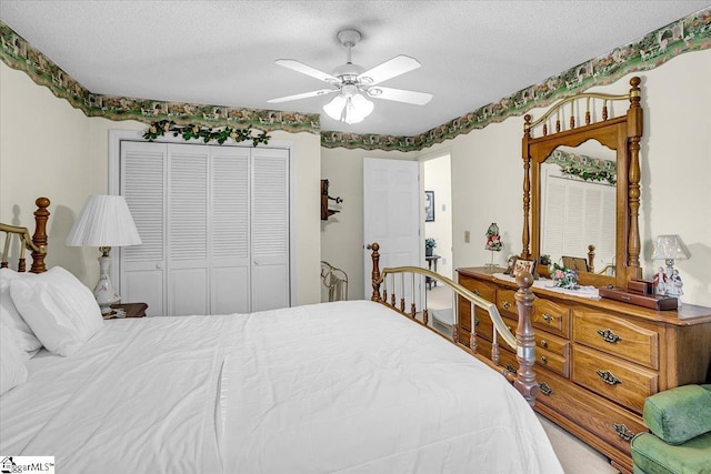 bedroom with a closet, a textured ceiling, and ceiling fan