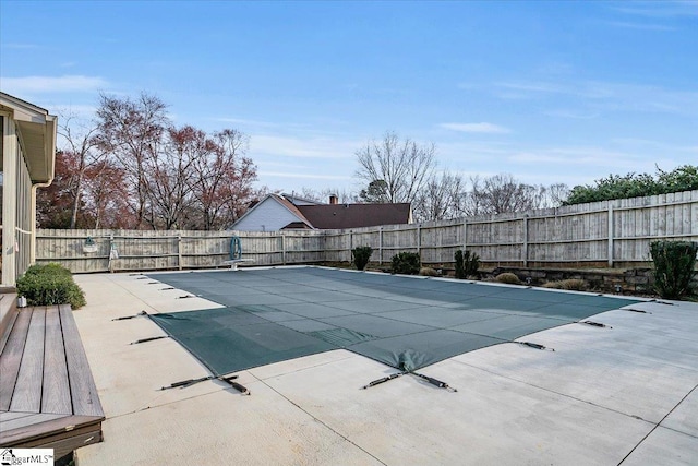 view of pool featuring a fenced in pool, a patio, and a fenced backyard