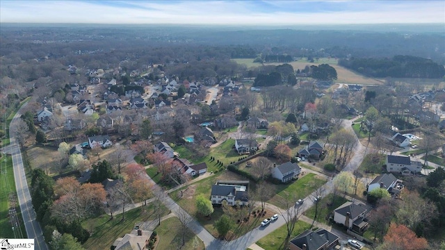 birds eye view of property with a residential view