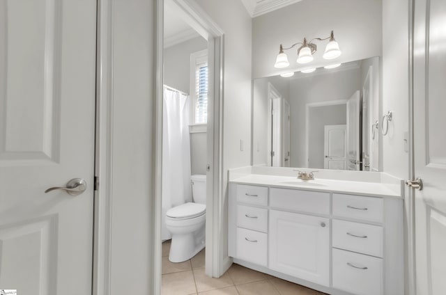 bathroom with tile patterned flooring, crown molding, toilet, and vanity