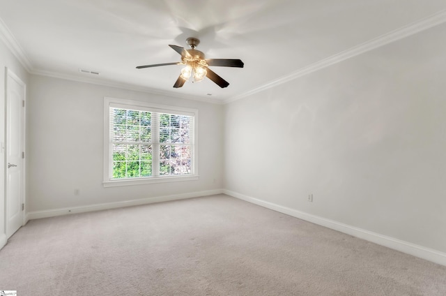 empty room with visible vents, light carpet, a ceiling fan, and crown molding