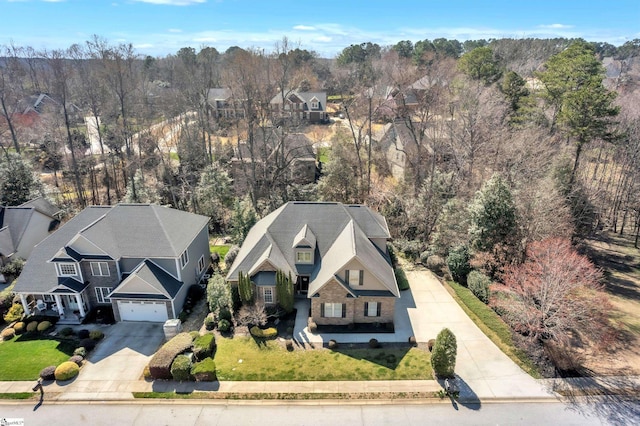 bird's eye view featuring a forest view