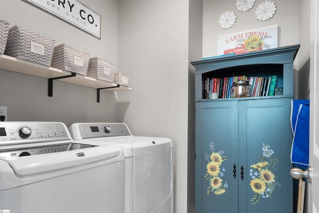 clothes washing area featuring laundry area and washing machine and dryer