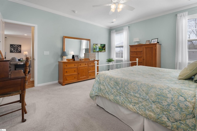 bedroom with ceiling fan, baseboards, light colored carpet, and ornamental molding