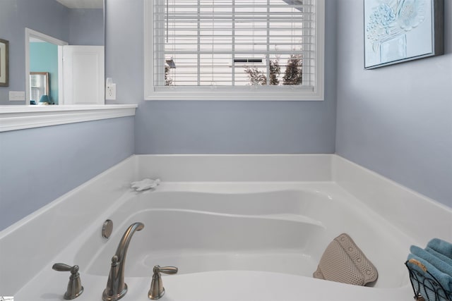 bathroom with a garden tub