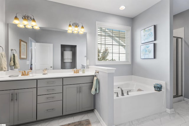 full bathroom with a stall shower, marble finish floor, and a sink