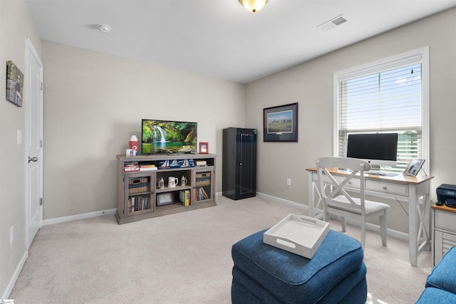 carpeted home office featuring baseboards and visible vents