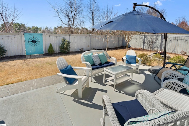 view of patio featuring a fenced backyard and outdoor lounge area